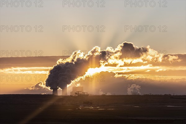 The Schwarze Pumpe coal-fired power plant stands out against the rising sun