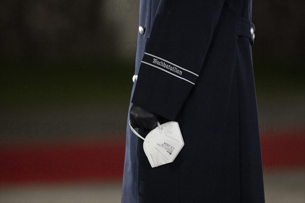 A soldier from the Guard Battalion of the German Armed Forces wearing mouth-nose protection