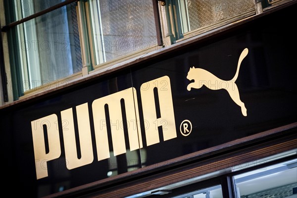 The logo of the sporting goods manufacturer PUMA in a branch in Berlin