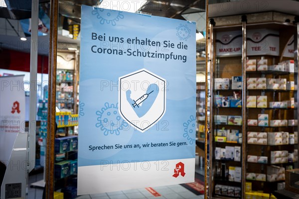 A poster in a pharmacy advertising the possibility to be vaccinated at pharmacies in Duesseldorf