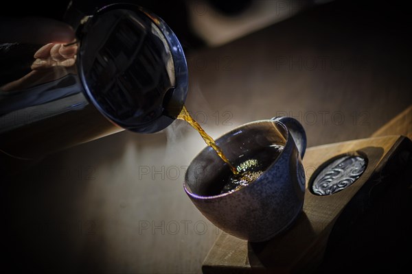 Coffee is poured into a cup. Berlin