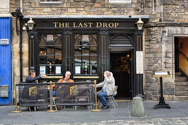 Visitors outside The Last Drop pub