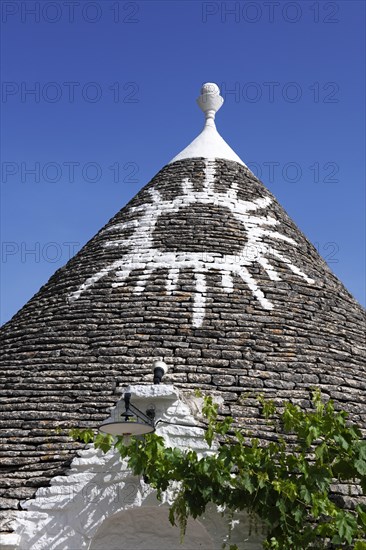 Trulli with symbol on the roof