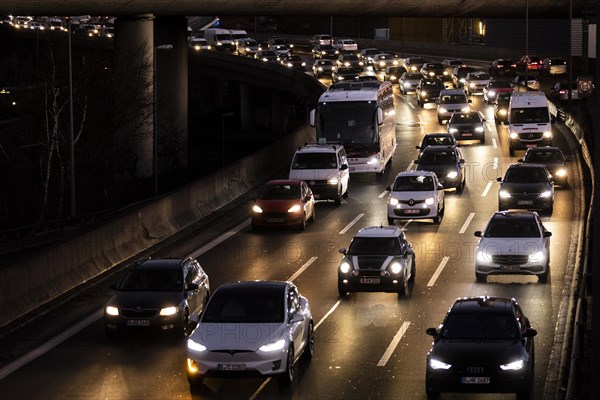 Congested traffic on the A100 looms at blue hour in Berlin