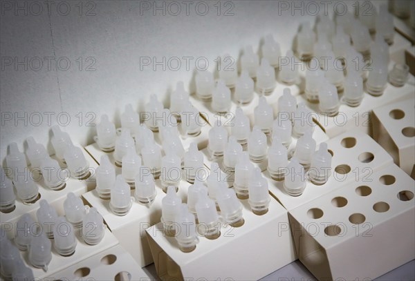Rapid test sample cups ready for use in a COVID-19 vaccination and testing centre at Autohaus Olsen in Iserlohn