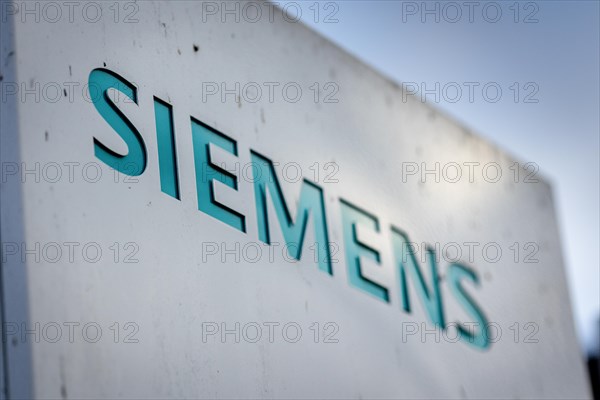 A Siemens company sign in front of a branch office in Siemensstadt in Berlin