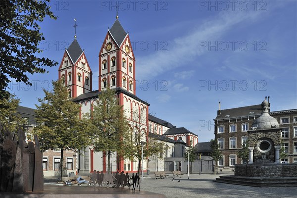 Fountain and the Church of Saint Bartholemew at the place Saint-Barthelemy