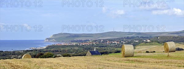 Mowed field with view over the village Escalles and Cap Blanc Nez with obelisk of the Dover Patrol Memorial