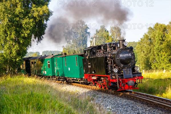 Steam train Rasender Roland railway steam locomotive on the island of Ruegen in Serams