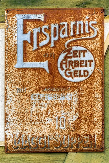 Rusty historical tin sign