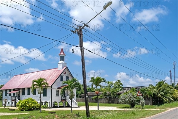 White wooden colonial church on stilts in the coastal town New Amsterdam