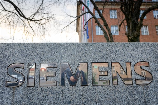 A Siemens company sign in front of a branch office in Siemensstadt in Berlin