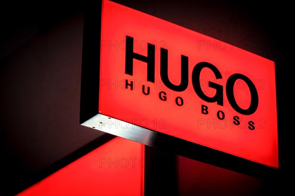 Logos of the fashion manufacturer HUGO Boss at a branch in Berlin