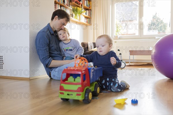 Subject: Father with two children aged nine months and three years.