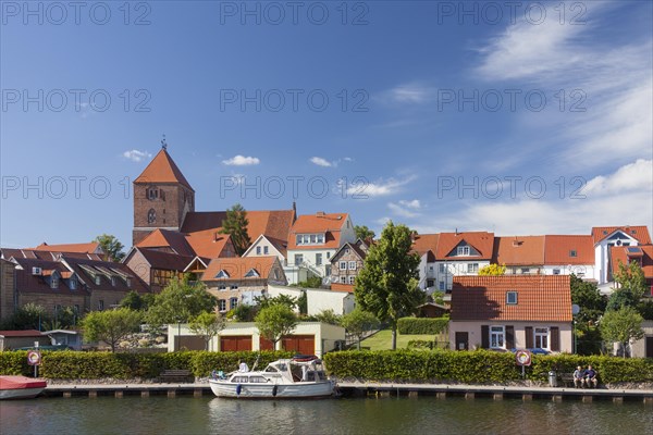 Pleasure boat in the Elde river moored at Plau am See