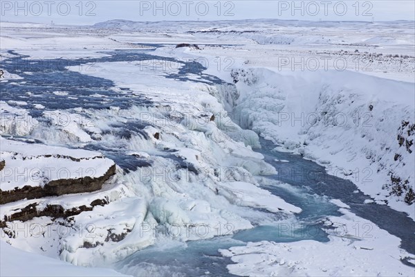 Gullfoss waterfall in the snow in winter located in the canyon of Hvita river