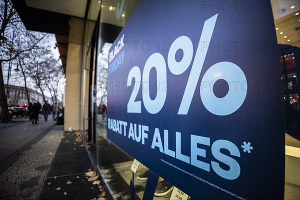 Signs indicating discounts stand out at a shopping centre on Schlossstrasse in Berlin