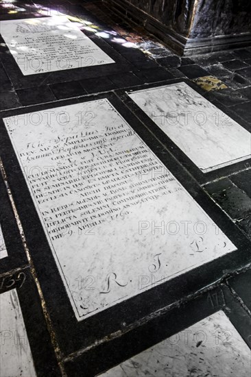 18th century epitaph in Latin on white marble gravestone