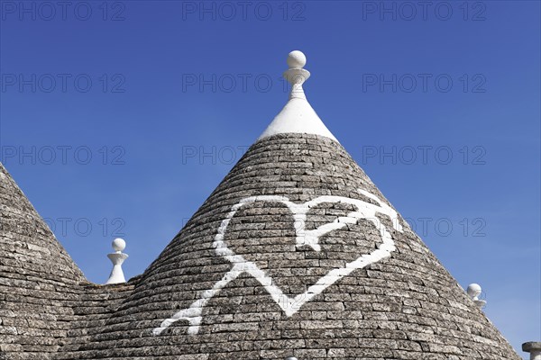 Trulli with symbol on the roof