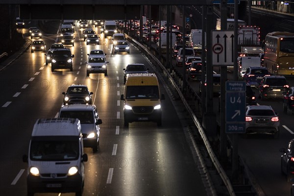 Congested traffic on the A100 looms at blue hour in Berlin