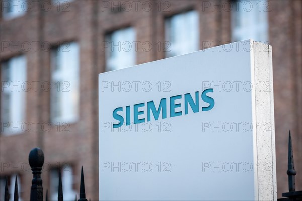 A Siemens company sign in front of a branch office in Siemensstadt in Berlin