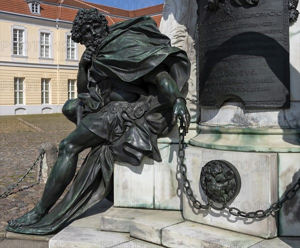 Detail photo of the chained warriors at the base of the equestrian statue of Frederick William of Brandenburg