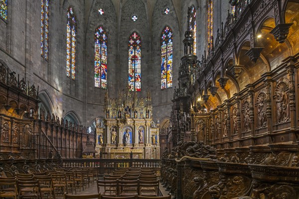 Carved wooden choir stalls and altar in the Cathedrale Notre-Dame de Saint-Bertrand-de-Comminges cathedral
