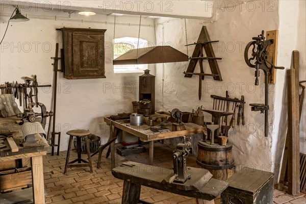 Workbench and tools in a tinsmith's workshop