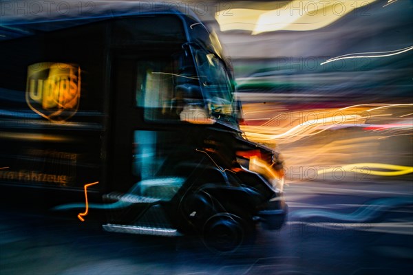 A delivery vehicle of the American shipping company UPS drives through a street in Duesseldorf