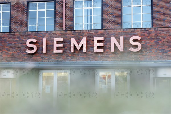 A Siemens company sign in front of a branch office in Siemensstadt in Berlin