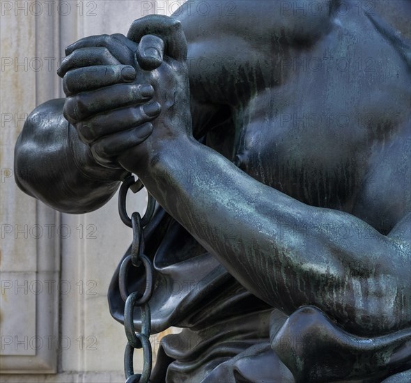 Detail photo of the chained warriors at the base of the equestrian statue of Frederick William of Brandenburg