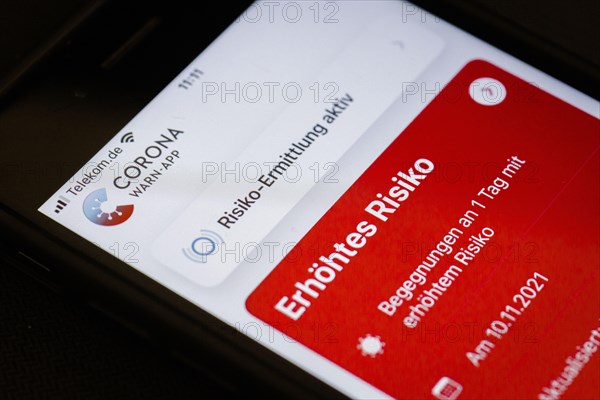 The Corona Warn app displays the words Increased Risk on a smartphone. Berlin