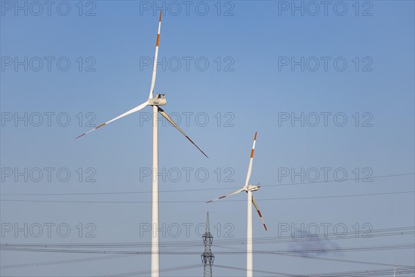 Two wind turbines and a high-voltage pylon stand out near Luckau