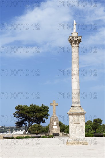 Column of the Madonna in front of the Sanctuary of San Marina de Leuca on the harbour