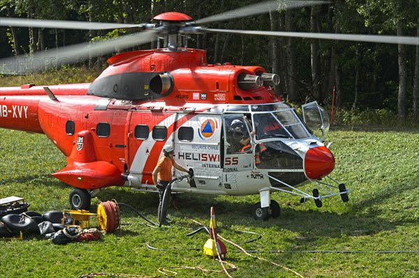 Multi-purpose transport helicopter AS 332 Super Cougar C1 of Heliswiss International AG being refuelled