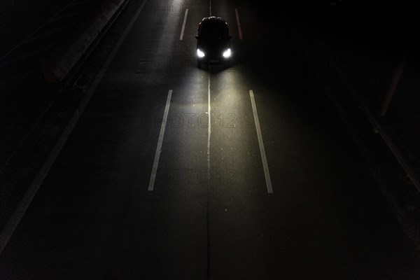 A car on the A100 stands out at blue hour in Berlin