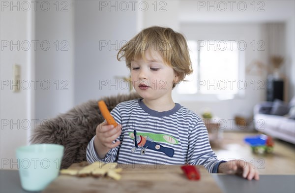 Subject: Toddler having breakfast with blueberries
