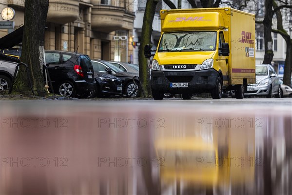 A vehicle of the parcel service DHL