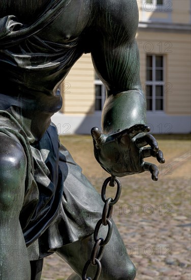 Detail photo of the chained warriors at the base of the equestrian statue of Frederick William of Brandenburg