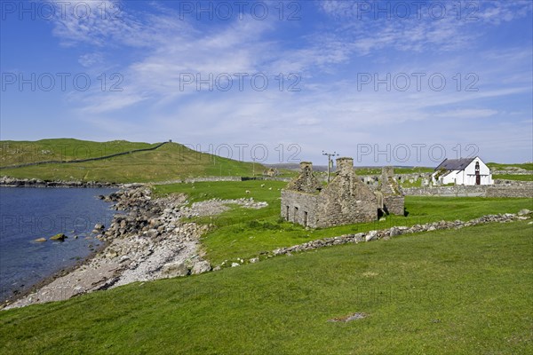 Ruin of old fishing booth and 18th century Lunna Kirk at East Lunna Voe