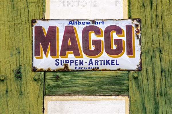 Rusty historical enamel sign