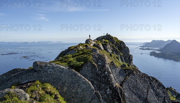 Hikers at the top of Dronningsvarden or Stortinden