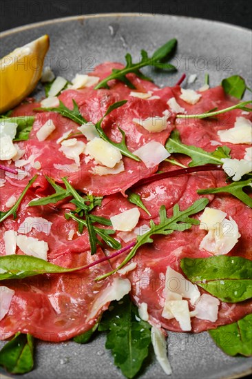 Marbled beef carpaccio with arugula and chard leaves