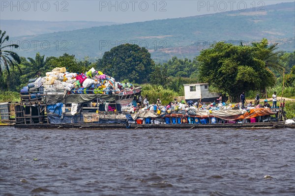 Overloaded riverboat on the Congo river