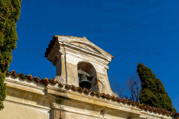 Church with Bell and a tree with Clear Blue Sky in Park San Michele in Castagnola in Lugano