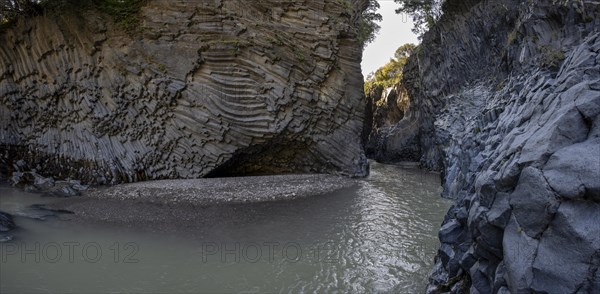 Rock formations of basalt and lava rock in the river park Gole dell' Alcantara