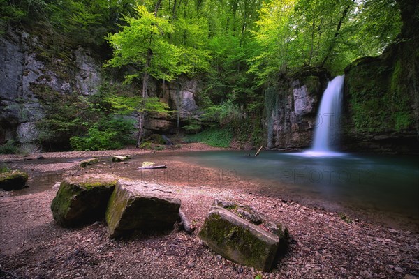 Waterfall in the forest with small pond near Kilchberg