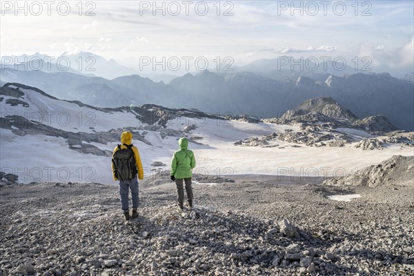 View of rocky plateau with glacier and remnants of snow