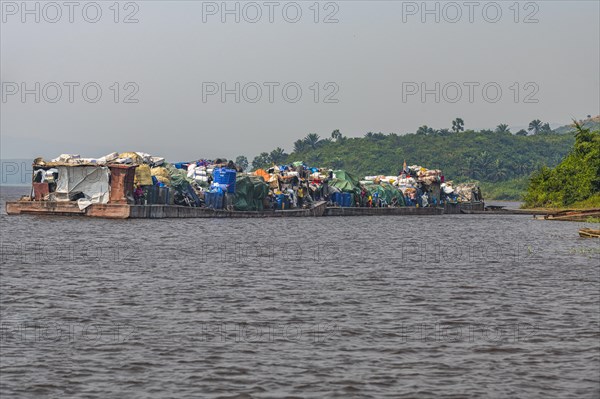 Overloaded riverboat on the Congo river