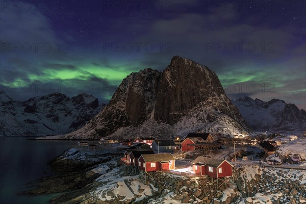 Northern Lights or Aurora Borealis over red rorbuer